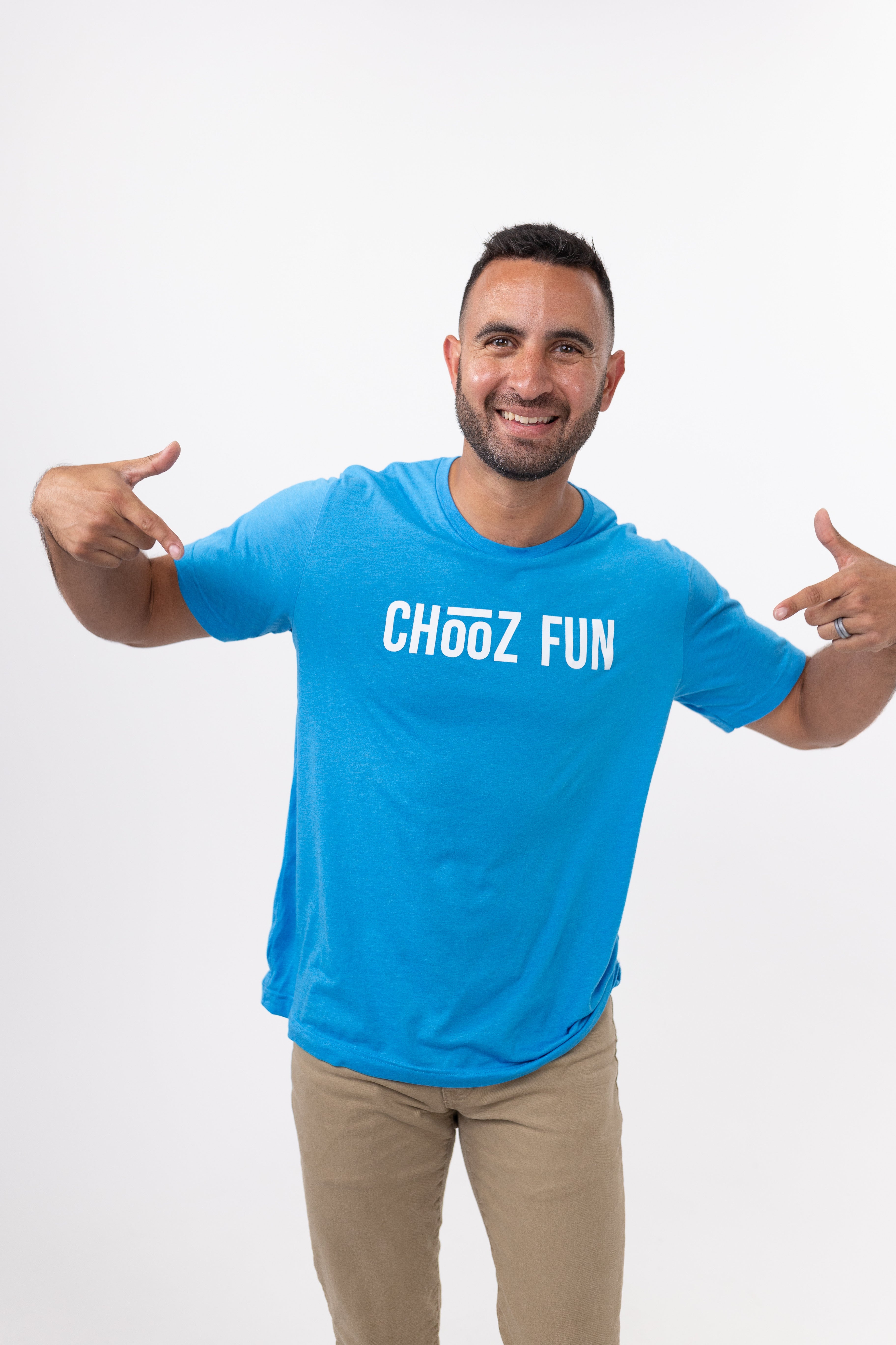 Man smiling in neon blue CHooZ FUN shirt on white background