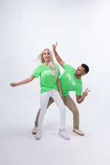 Couple dancing in matching neon green CHooZ FUN tees on white backdrop. The FUN Mark Tee – Neon Series sparks retro joy with festival-ready vibes.