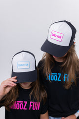 Two girls in CHooZ FUN tees rocking Lil’ FUN Mark Hats — one with blue patch, one with pink — double the drip, double the energy