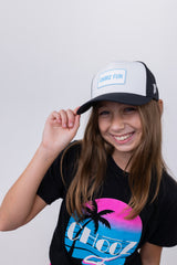Youth wearing the Lil’ FUN Mark Hat – White with Blue Patch – front view